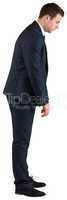 Businessman standing and bowing