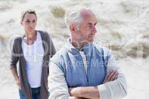 Couple not talking after argument on the beach