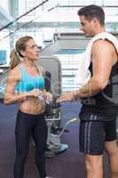 Bodybuilding man and woman talking together