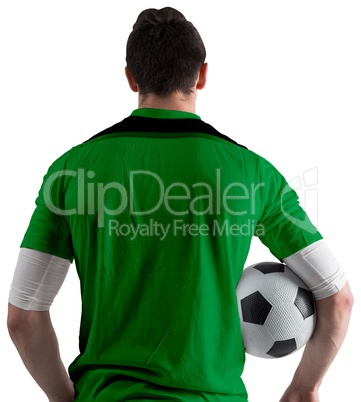 Football player in green holding ball