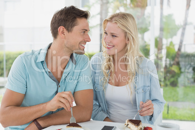 Hip young couple having desert together