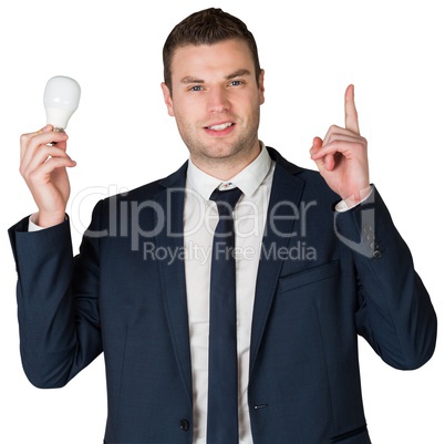 Businessman holding light bulb and pointing