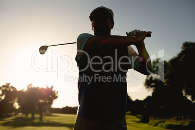 Golfer teeing off for the day