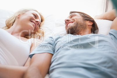 Cute couple lying on a bed