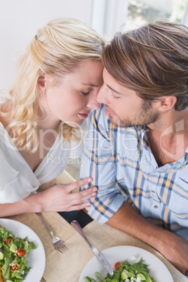 Happy couple enjoying a meal together