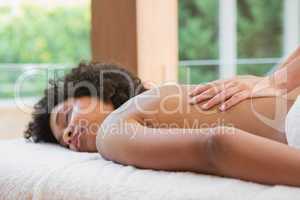 Gorgeous woman enjoying a back massage