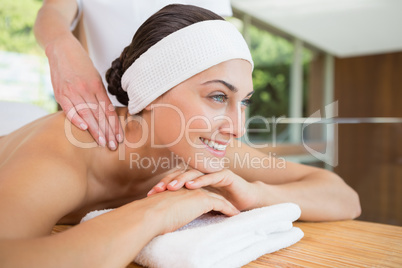 Smiling woman getting a back massage