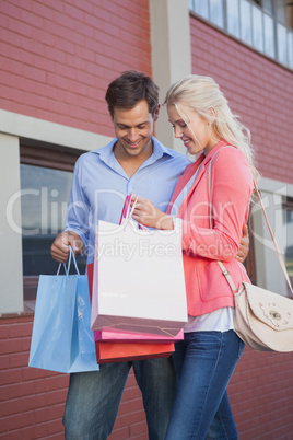 Stylish young couple on a shopping trip