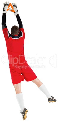 Goalkeeper in red jumping up