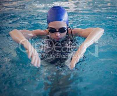 Fit woman swimming in the pool