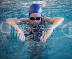 Fit woman swimming in the pool