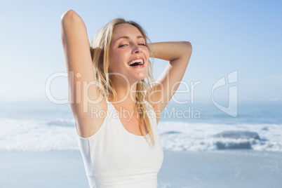 Gorgeous happy blonde posing at the beach