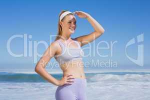 Sporty smiling blonde on the beach