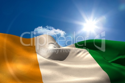 Ivory coast national flag under sunny sky