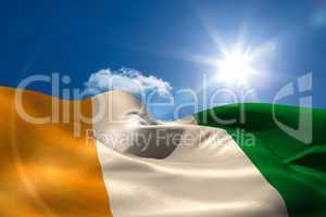 Ivory coast national flag under sunny sky