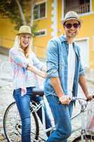 Hip young couple going for a bike ride