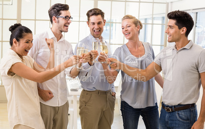 Casual business team celebrating with champagne