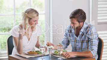 Young couple enjoying a meal together