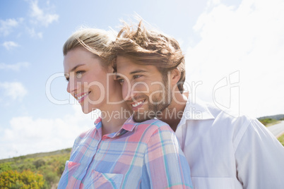 Smiling couple standing outside together