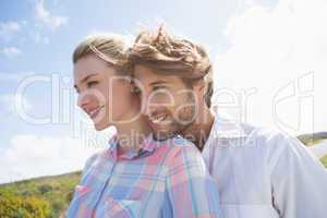 Smiling couple standing outside together