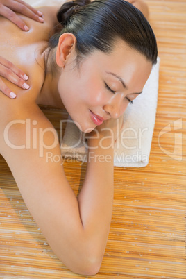 Smiling woman getting a back massage Smiling woman getting a back massage