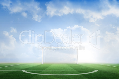 Football pitch under blue sky