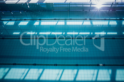 Large swimming pool with sunlight streaming in