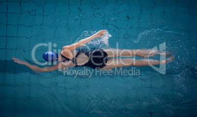 Fit woman swimming in the pool