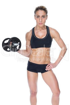 Female bodybuilder holding large black dumbbell with arm up look