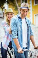 Hip young couple going for a bike ride