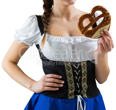 Pretty oktoberfest girl holding pretzel