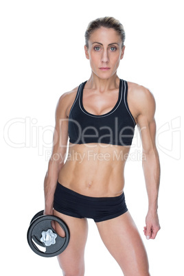 Female bodybuilder holding large black dumbbell with arm down lo