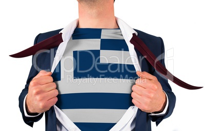 Businessman opening shirt to reveal greece flag