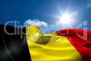 Belgian national flag under sunny sky