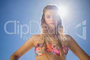 Beautiful blonde in floral bikini on the beach