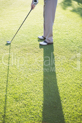 Golfer standing on the putting green