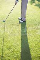 Golfer standing on the putting green