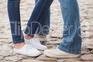 Couple in jeans standing on path