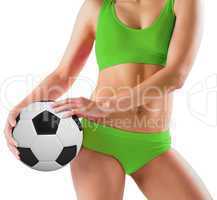 Fit girl in green bikini holding football