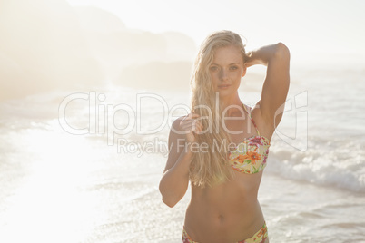 Gorgeous blonde in floral bikini posing at the beach