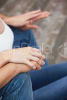 Hip young couple in denim sitting on steps