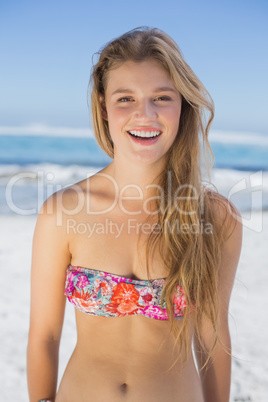 Beautiful happy blonde on the beach