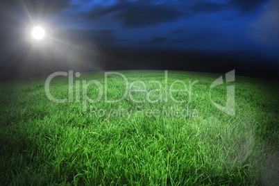 Football pitch under night sky