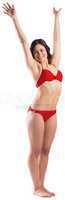 Fit brunette in red bikini posing