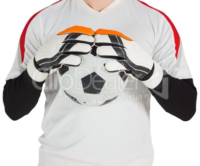 Goalkeeper in white holding ball