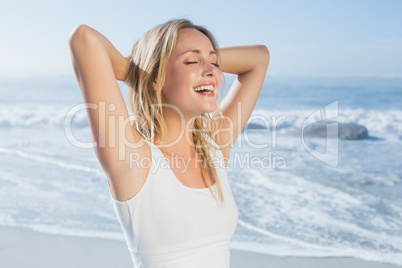 Gorgeous happy blonde posing at the beach