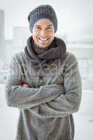 Handsome man in warm clothing smiling at camera