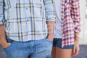 Young hip couple wearing check shirts and denim