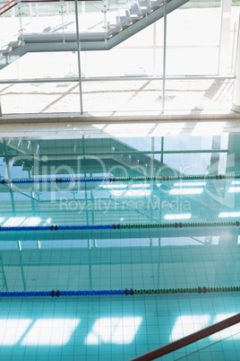 Large swimming pool with sunlight streaming in