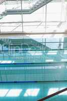 Large swimming pool with sunlight streaming in